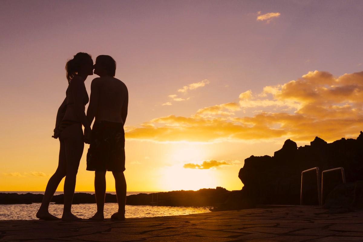 couple at the beach at romantic sunset IN TENERIFE